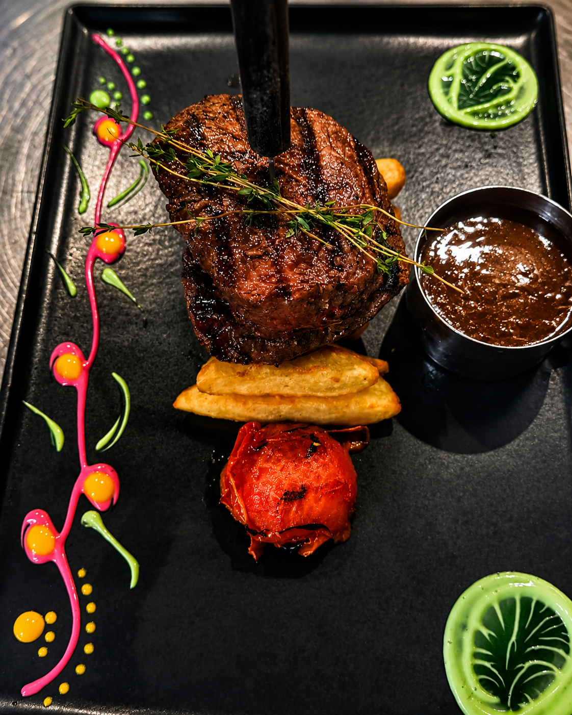 Plated meat dish with decorative presentation